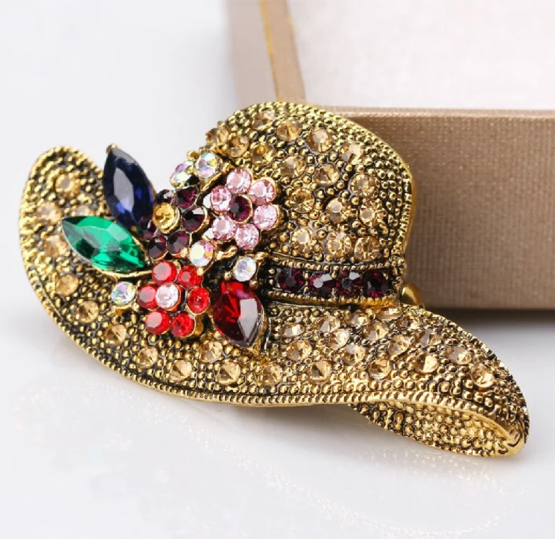 Small rhinestone brooch shaped like a hat